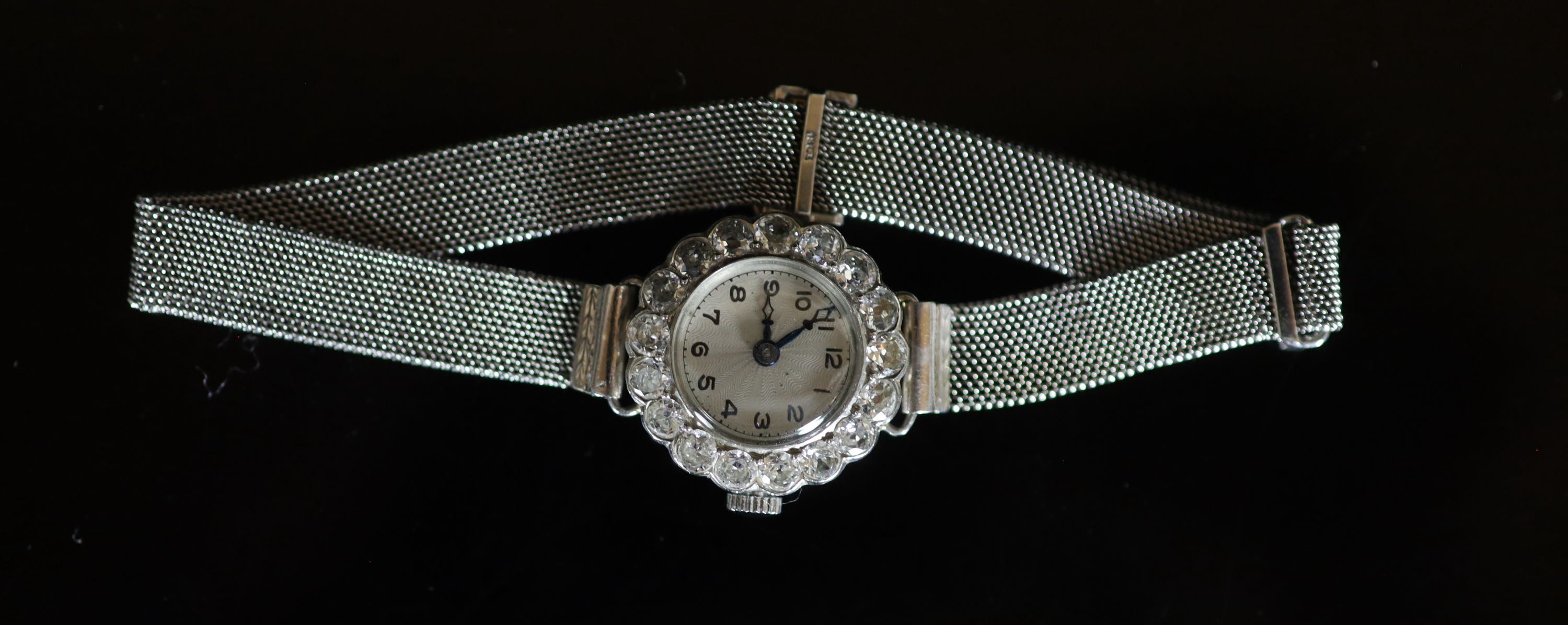 A lady's platinum and diamond set manual wind cocktail watch, on an 18ct white gold mesh link bracelet